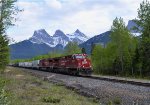 CP 8055/8131 leading a W/B mixed freight consist through Canmore, Alberta with the "Three Sisters" mountains directly behind them